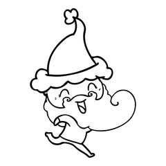 happy bearded man wearing santa hat