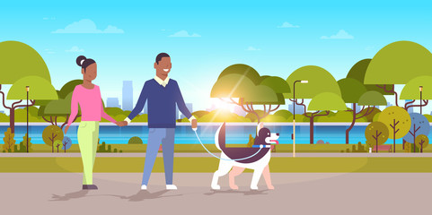 couple walk with husky dog african american man woman walking city urban park sunset landscape background people having rest outdoor flat horizontal full length