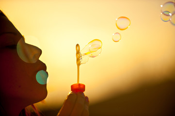 Blowing Bubbles in Sunset