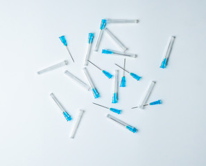 Hypodermic syringe. Syringes with blue needles. Medical Injectors on isolated white background 
