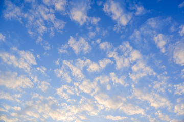 The image of the bright blue sky has some clouds.
