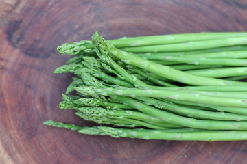 Raw asparagus. Fresh Asparagus on wooden background