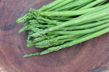 Raw asparagus. Fresh Asparagus on wooden background