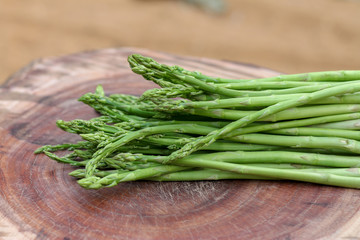 Raw asparagus. Fresh Asparagus on wooden background