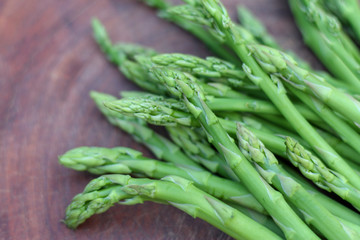 Raw asparagus. Fresh Asparagus on wooden background