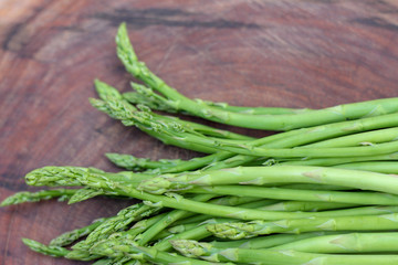 Raw asparagus. Fresh Asparagus on wooden background