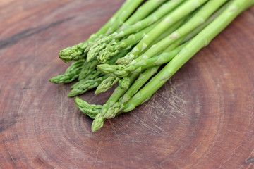 Raw asparagus. Fresh Asparagus on wooden background