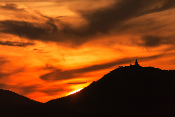 silhouette of big buddha at sunset