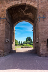 Obraz premium Italy, Rome, Roman Forum, an arch welcoming into a garden