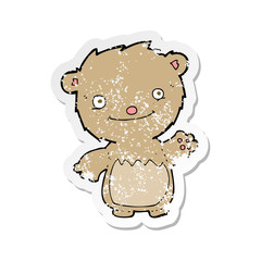 retro distressed sticker of a cartoon waving teddy bear