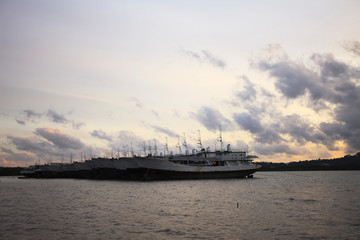 Fototapeta na wymiar Old fishing boat at sunset