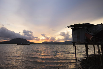Old fishing boat at sunset