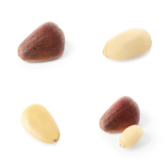 Set of different delicious organic pine nuts on white background