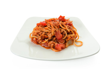 Spaghetti bolognese on a white plate.