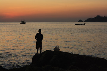fishing at sunset