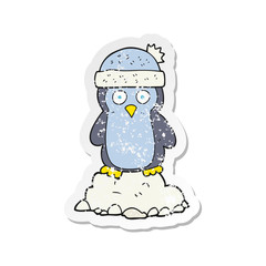 retro distressed sticker of a cartoon penguin wearing hat