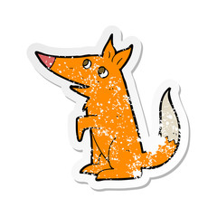 retro distressed sticker of a cartoon fox cub