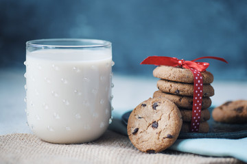 Stack of Chocolate chip cookie and glass of milk..