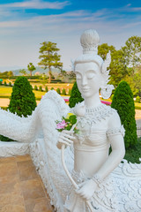 White angel statue in buddhist thai temple