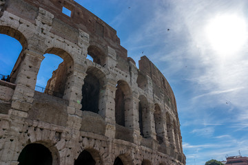 Fototapeta premium Facade of the Great Roman Colosseum (Coliseum, Colosseo), also known as the Flavian Amphitheatre. Famous world landmark