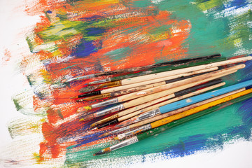 Paint brushes and paints for drawing.