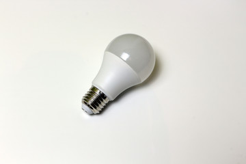 Energy saving light bulb on white background isolated