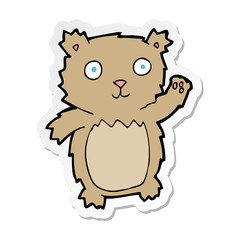 sticker of a cartoon waving teddy bear