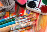 Paint brushes and paints for drawing.