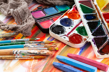 Paint brushes and paints for drawing.