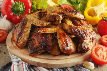 Chicken wings barbecue with different vegetables	