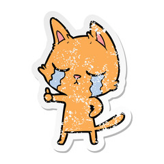 distressed sticker of a crying cartoon cat