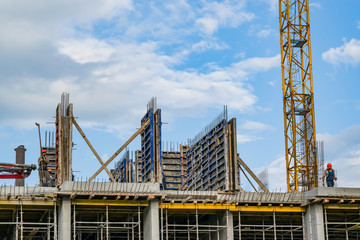 Fototapeta na wymiar Building construction, start of construction against the blue sky