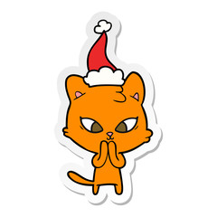 cute sticker cartoon of a cat wearing santa hat