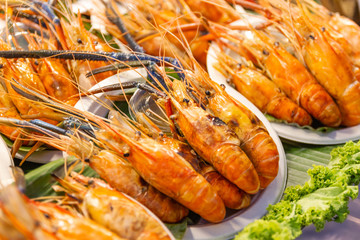 Grilled shrimps seafood on the table in market of Bangkok Thailand 