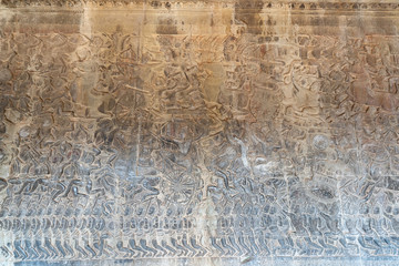 Fototapeta na wymiar Relief of battle of Kurukshetra on the wall of gallery of Angkor Wat temple