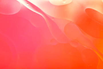 Blurred abstract background. Image of abstract wavy lines and circles of red and orange color. Cropped shot, horizontal, blurred, free space, nobody