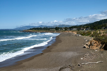view of beach with the surf, sea and blue sky