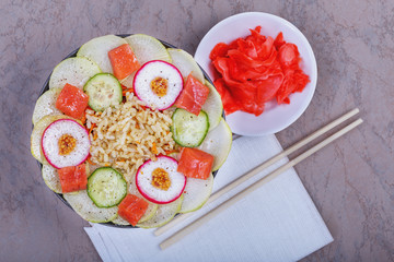 Poke bowl trend. Raw fish, rice and healthy vegetables on wooden background