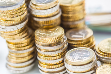 Towers with euro coins stacked together - close-up