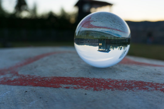 Crystal ball photo with heart and beautiful landscape