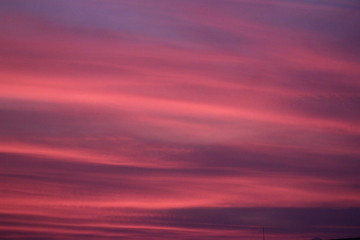 red sky in the middle of the ocean