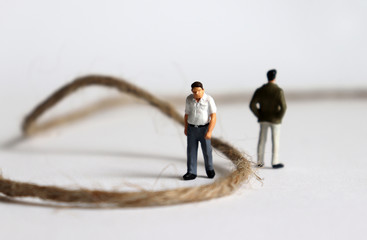 Miniature people. A concept of generational conflict.