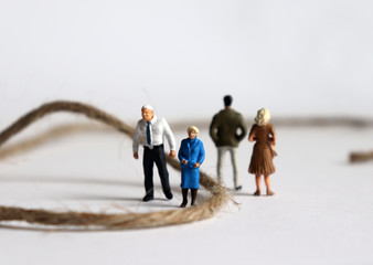 Miniature people. The concept of conflict between parents and children.