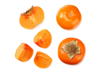 fresh ripe persimmons with slices isolated on white background. top view