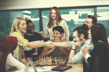 multiethnic group of business people playing chess