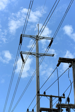 High-voltage electric pole with sky Used as a background image Power transmission lines that are high-voltage power poles, power transmission systems