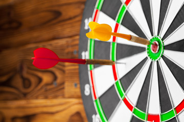 Fototapeta premium The darts on wooden background