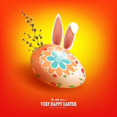 Easter orange composition with egg, rabbit ears and willow branch,