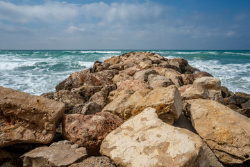 Fototapeta na wymiar Stone breakwater in the ocean