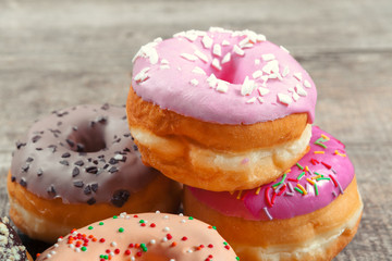 Glazed donuts on wooden background